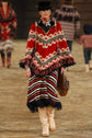 Chanel 2014 multicolour striped knit midi skirt with fringe details, stylish and vibrant for fashion-forward looks.