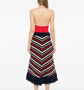 Multicolour striped knit midi skirt by Chanel featuring fringe detail, styled with a flowy, vibrant design.