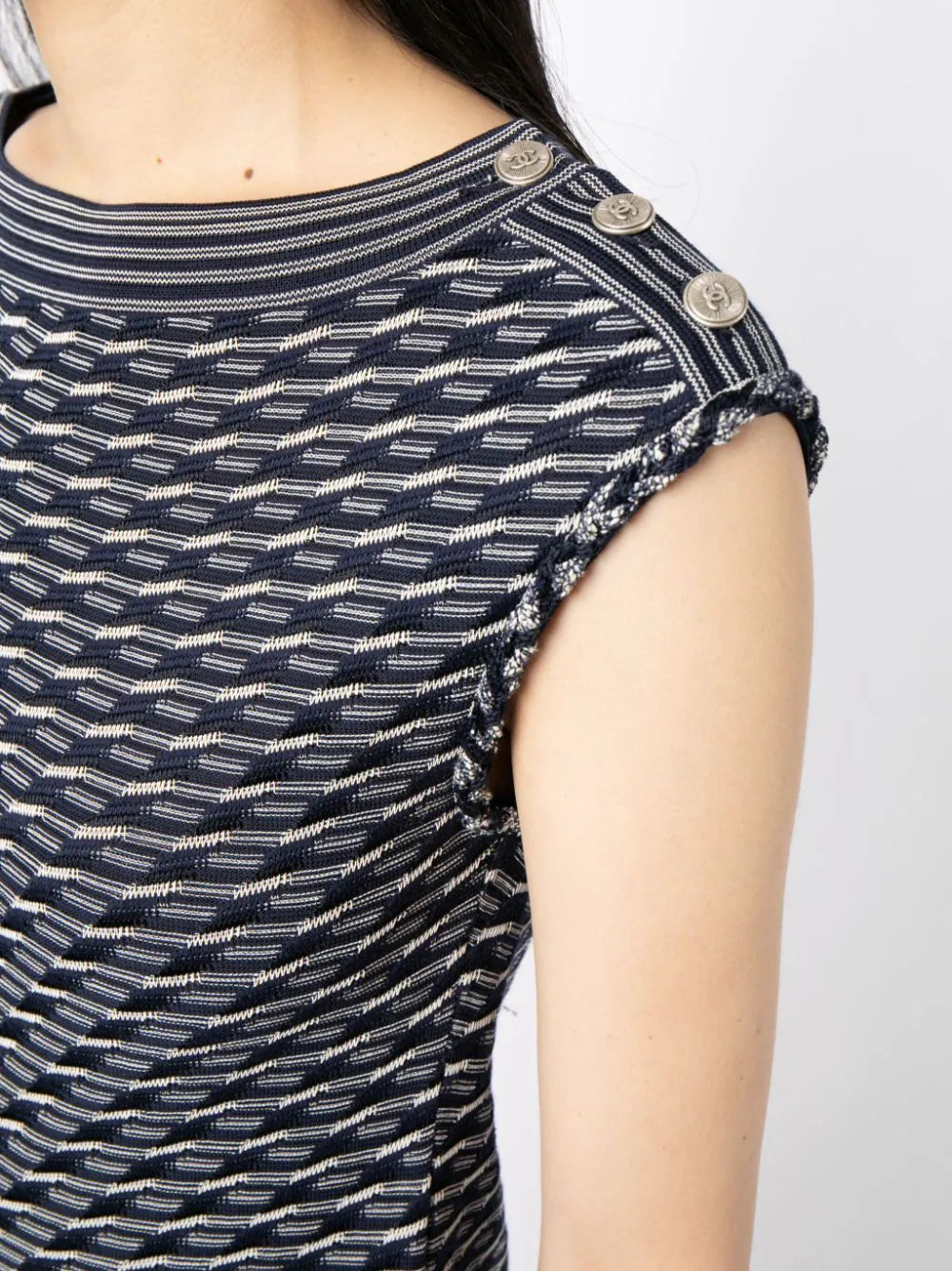 Navy and white Chanel jacquard boat-neck dress with a fitted silhouette and elegant pattern, displayed on a mannequin.