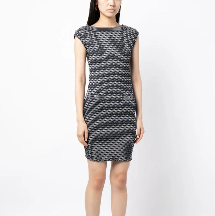 Navy and white Chanel jacquard boat-neck dress with elegant pattern, showcasing a sophisticated, stylish women&