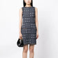 Navy and white Chanel winter knit dress with long sleeves and intricate pattern, stylish and cozy for cold weather.