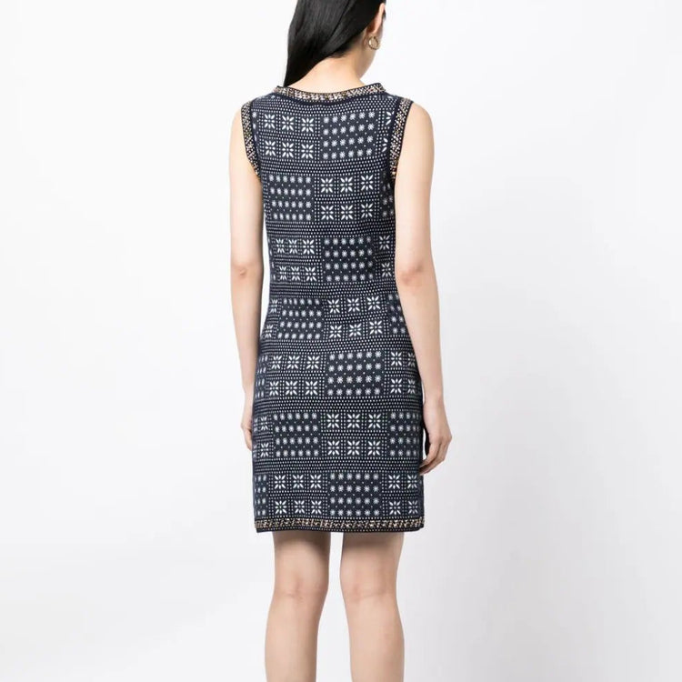 Navy and white Chanel winter knit dress with long sleeves and a fitted silhouette, perfect for cold weather.