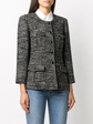 Chanel navy bouclé tweed jacket with collarless round neckline, long sleeves, textured navy and ivory weave, front button fastening, jewel-style buttons, and front pocket details.