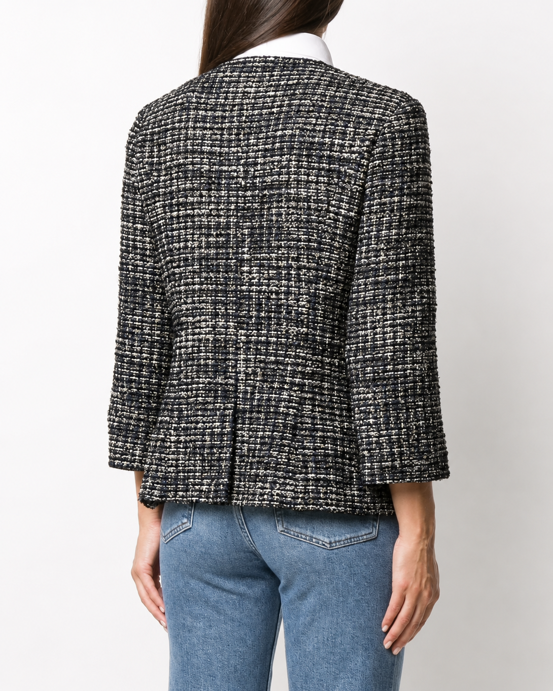 Chanel navy bouclé tweed jacket with collarless round neckline, long sleeves, textured navy and ivory weave, front button fastening, jewel-style buttons, and front pocket details.