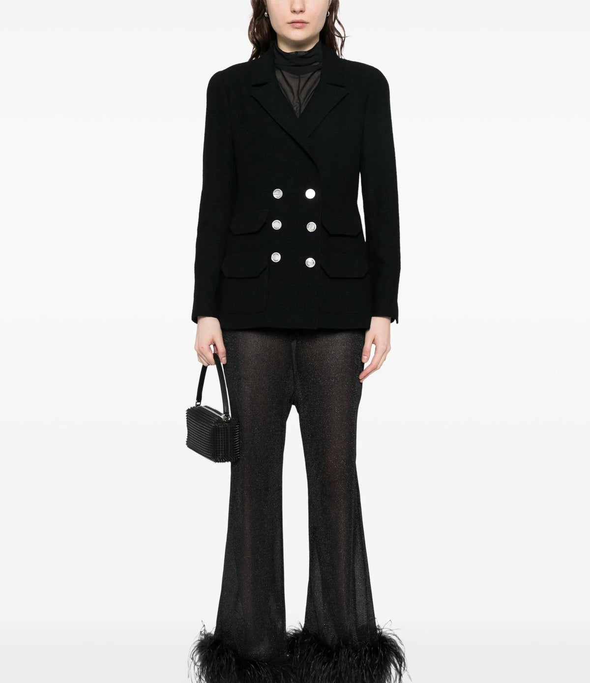 Navy double-breasted Chanel blazer with structured lapels and tailored fit, displayed on a hanger.