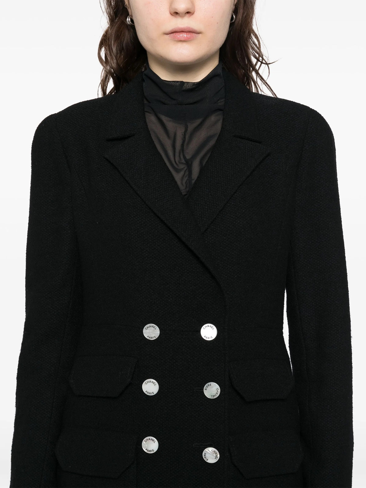 Navy double-breasted blazer by Chanel featuring tailored fit, classic lapels, and elegant design, ideal for sophisticated fashion.