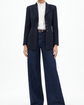 Navy Chanel layered pockets blazer with tailored fit, featuring structured design and front pocket details, ideal for sophisticated style.