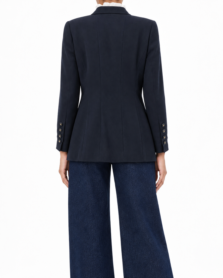 Navy layered pockets blazer by Chanel featuring tailored fit and classic style, shown on a model.