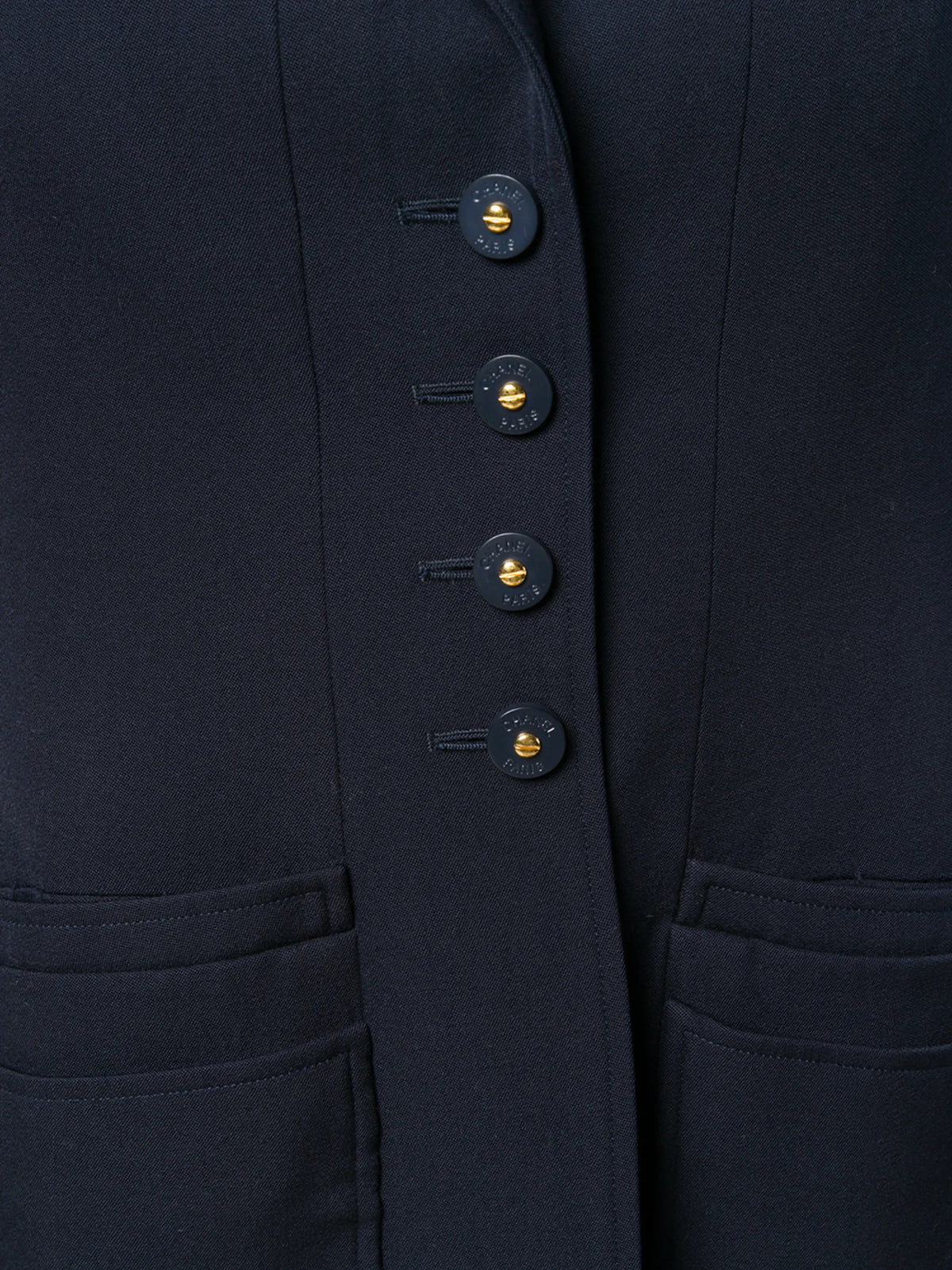 Navy layered pockets blazer by Chanel featuring tailored fit, structured design, and classic lapel, suitable for sophisticated style.