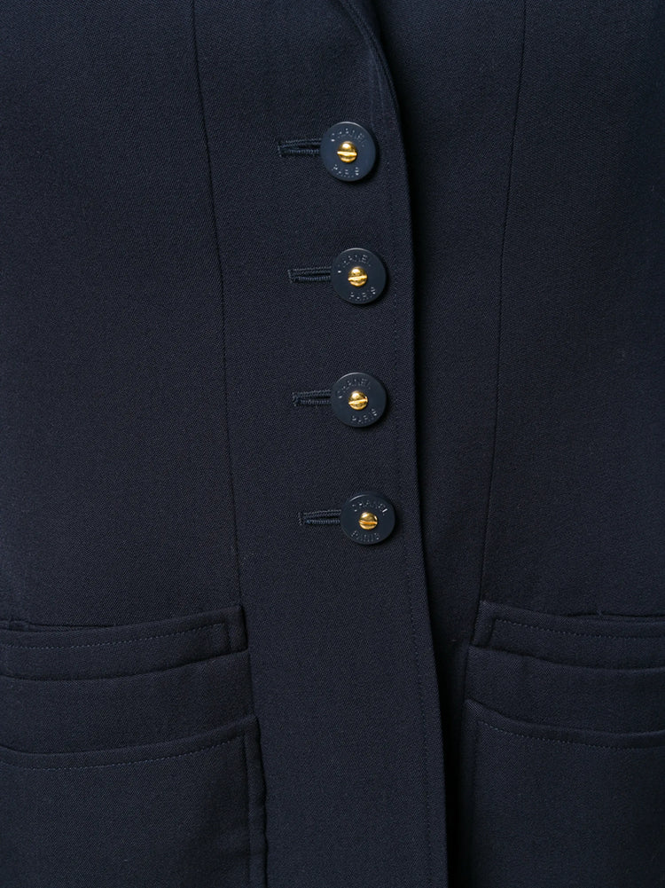 Navy layered pockets blazer by Chanel featuring tailored fit, structured design, and classic lapel, suitable for sophisticated style.