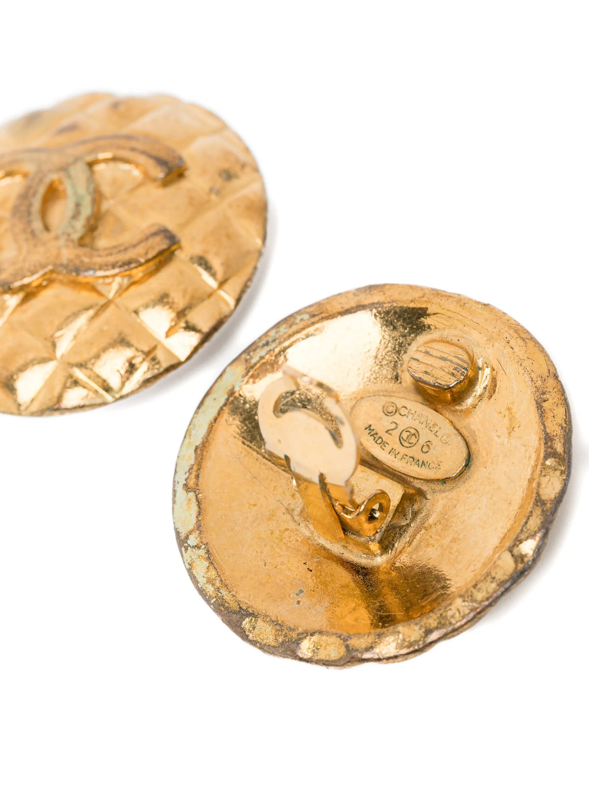 Chanel quilted gold clip-on earrings with a stylish, textured design for elegant accessories.