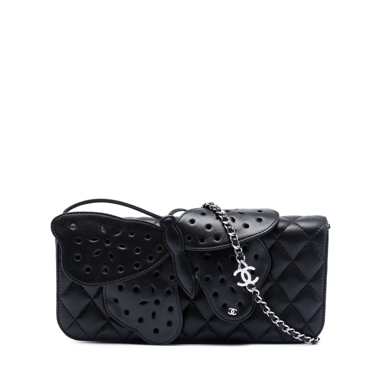 Chanel quilted lambskin butterfly clutch with chain strap, featuring a textured quilted design and elegant butterfly detail.