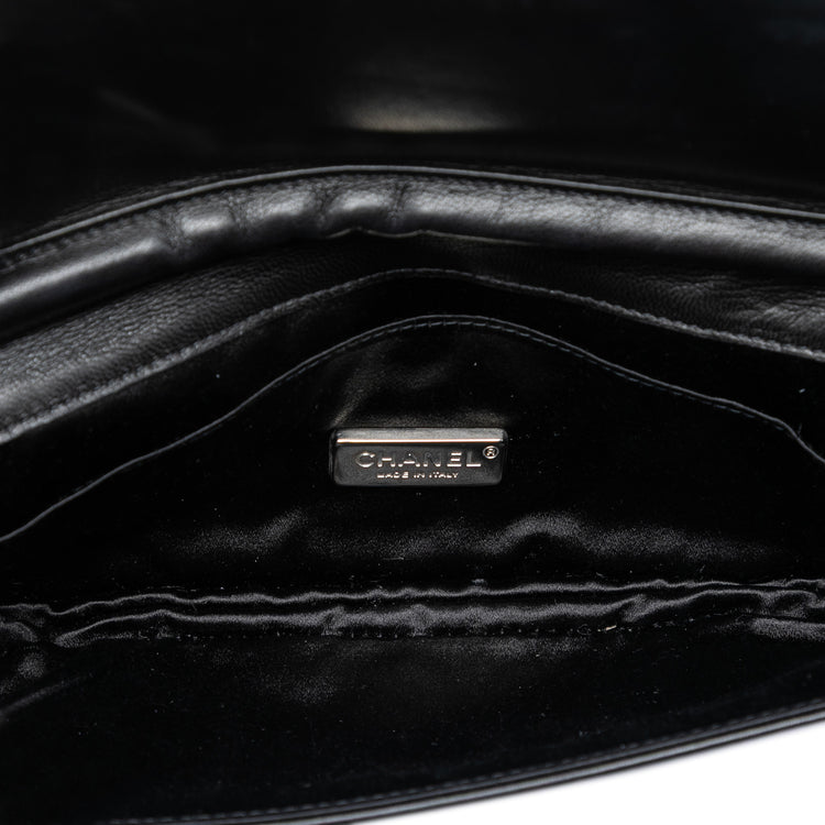 Chanel quilted lambskin butterfly clutch with chain strap, featuring a sleek, elegant design and signature quilting pattern.