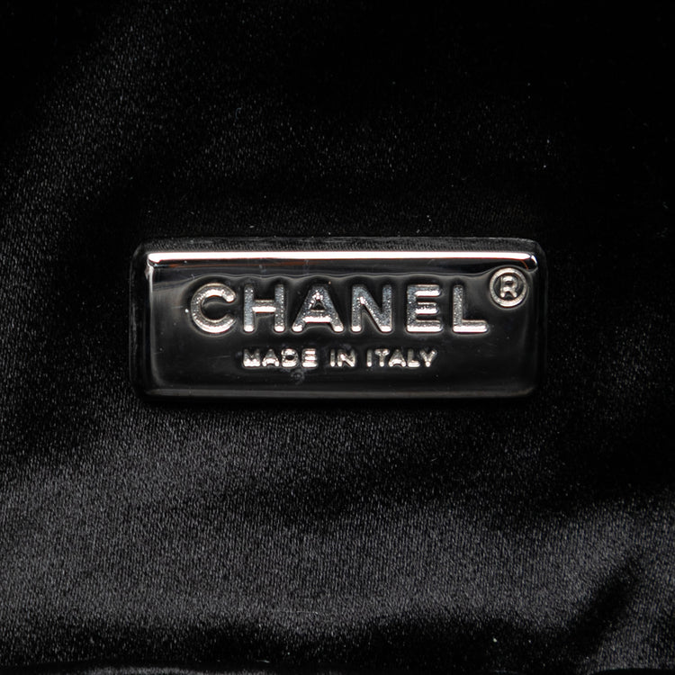 Chanel quilted lambskin butterfly clutch with chain strap, featuring a textured quilted design and elegant butterfly motif.