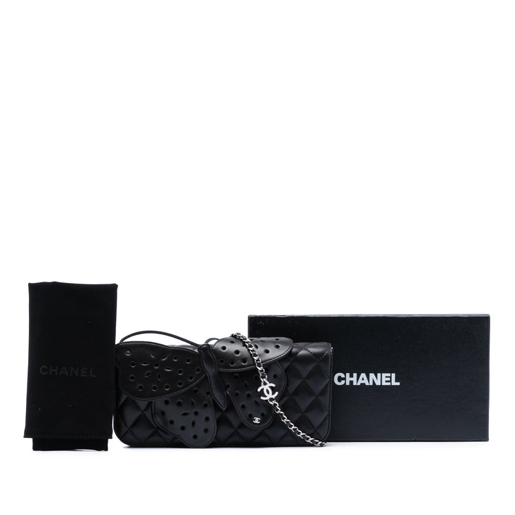 Chanel quilted lambskin butterfly clutch with chain strap, featuring a sleek, textured design and elegant gold-tone hardware.
