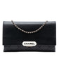 Chanel black quilted lambskin retro clutch bag with fold-over flap, front Chanel logo plaque, silver-tone chain detail and slim rectangular silhouette.