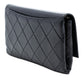 Chanel black quilted lambskin retro clutch bag with fold-over flap, front Chanel logo plaque, silver-tone chain detail and slim rectangular silhouette.