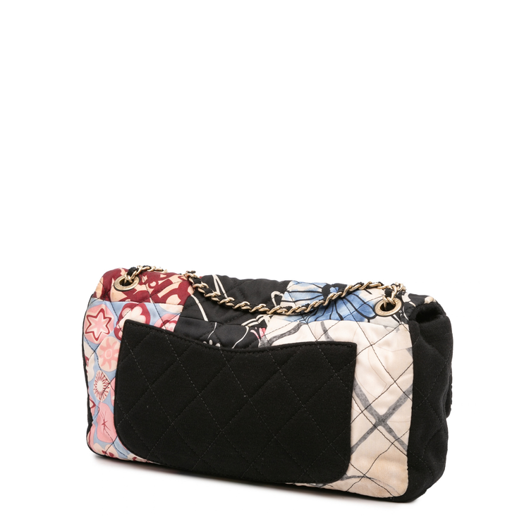 Chanel quilted patchwork medium flap shoulder bag with gold chain strap and signature quilted design.