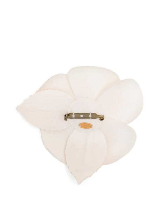 Chanel 2019 Camellia CC brooch featuring a silk camellia flower and classic CC logo, stylish jewelry accessory.