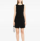 Chanel sleeveless Camellia wool dress featuring a fitted silhouette and floral embroidery, displayed on a mannequin.