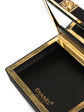 Chanel tassel vanity case, detail of the gold-tone clasp fastening