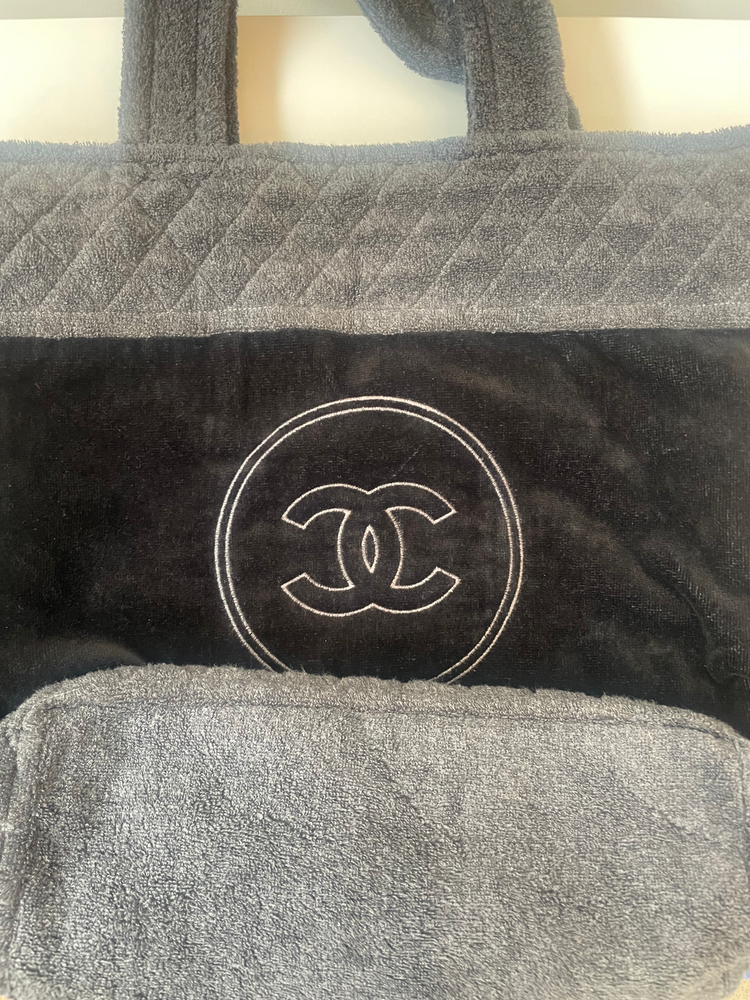 Chanel terry cloth tote bag with beige handles and spacious interior, stylish and practical for everyday use.