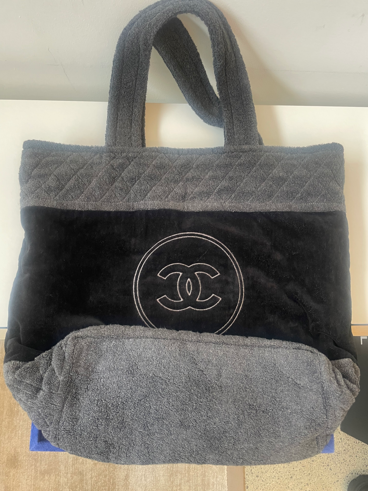Chanel black and charcoal grey terry cloth tote with quilted panels, dual top handles and tonal oversized interlocking CC logo.