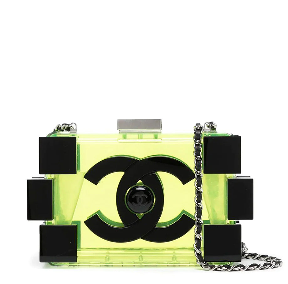 Chanel translucent yellow-green lucite Lego minaudière clutch with oversized black CC logo, black block detailing, top clasp and silver-tone chain strap.
