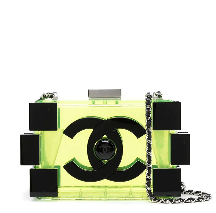 Chanel translucent yellow-green lucite Lego minaudière clutch with oversized black CC logo, black block detailing, top clasp and silver-tone chain strap.