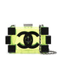 Chanel translucent yellow-green lucite Lego minaudière clutch with oversized black CC logo, black block detailing, top clasp and silver-tone chain strap.