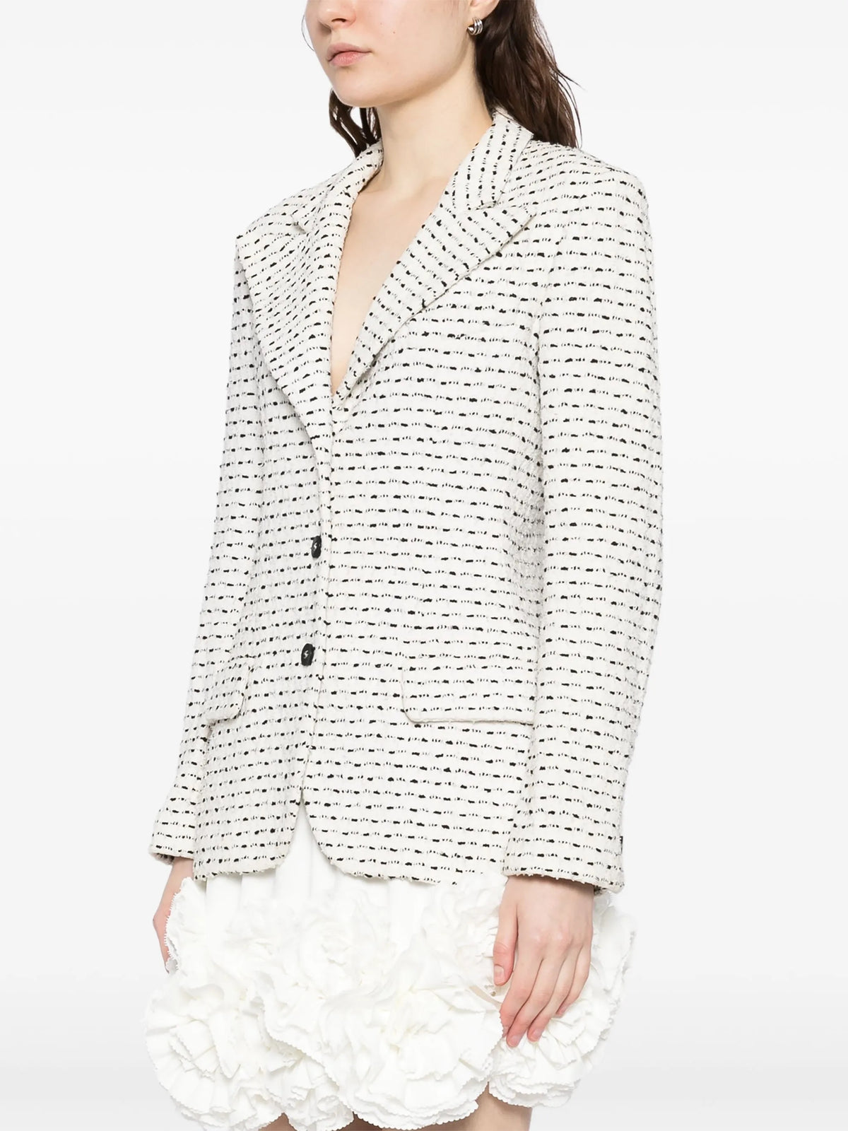 Chanel monochrome textured tweed blazer in black and white, tailored blazer with classic design and structured fit.
