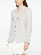 Chanel monochrome textured tweed blazer in black and white, tailored blazer with classic design and structured fit.