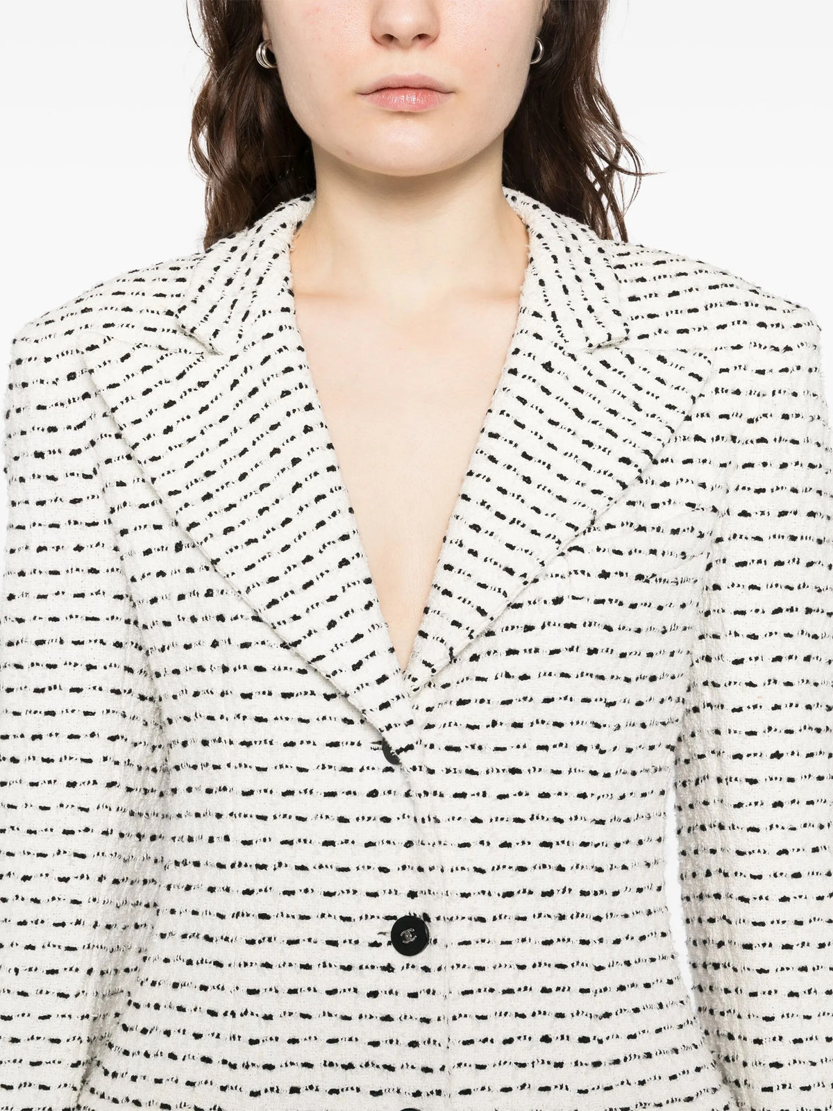 Chanel white and black textured tweed monochrome blazer with classic tailored fit, perfect for stylish formal or casual wear.