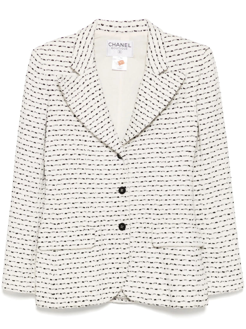 Chanel monochrome blazer in textured black and white tweed, tailored blazer with classic collar and structured fit.