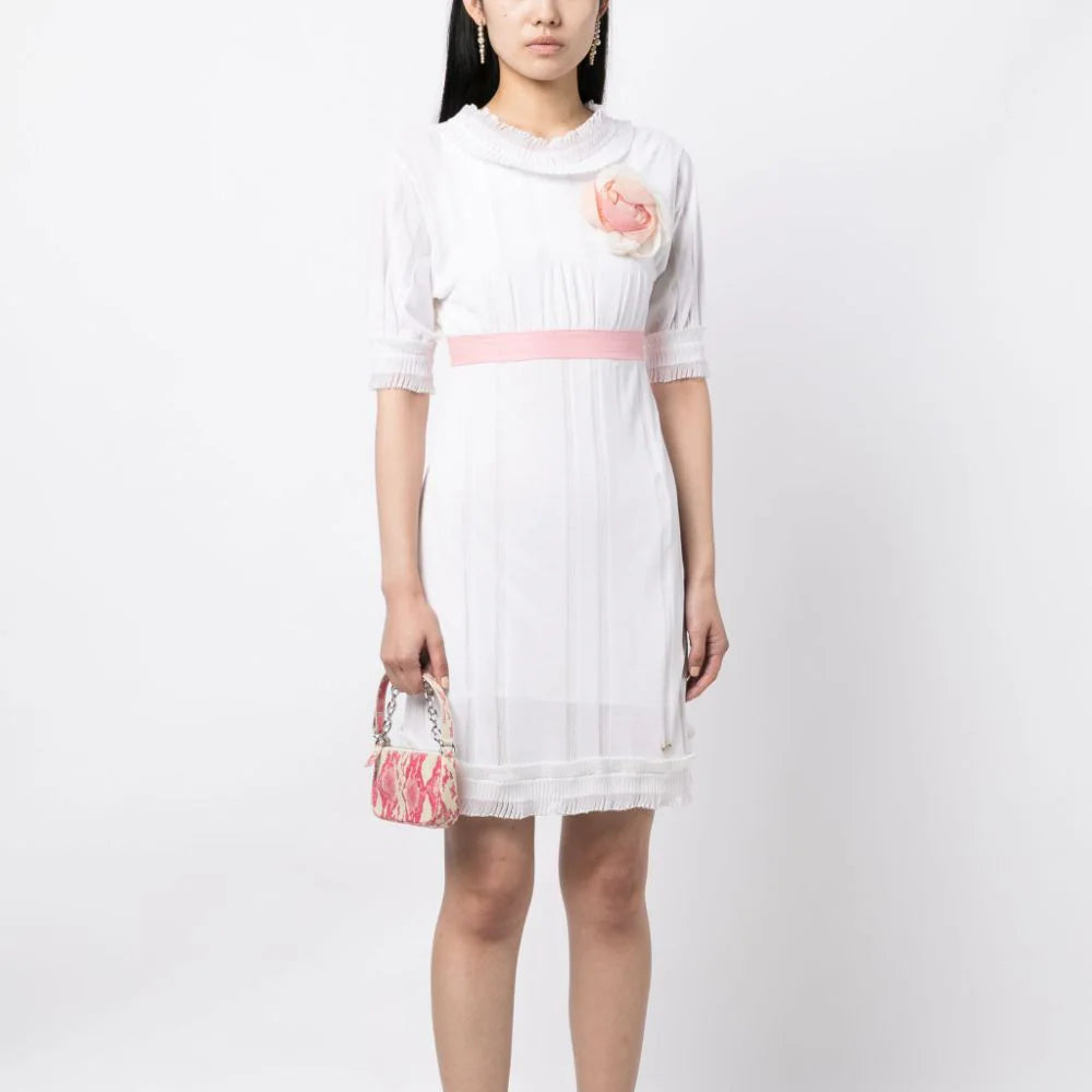 Chanel Camelia Babydoll Dress with delicate floral details, lightweight fabric, and relaxed fit, perfect for elegant casual wear.