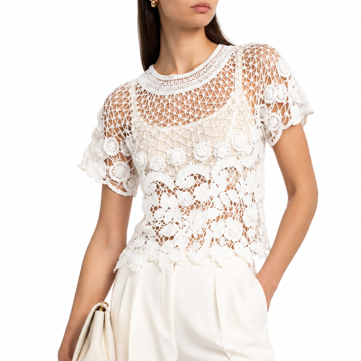 White crochet top by Chanel, cropped style with intricate knit details, perfect for stylish casual wear.