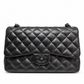 Chanel black quilted jumbo double flap shoulder bag made of crumpled lambskin with silver hardware, classic and stylish design