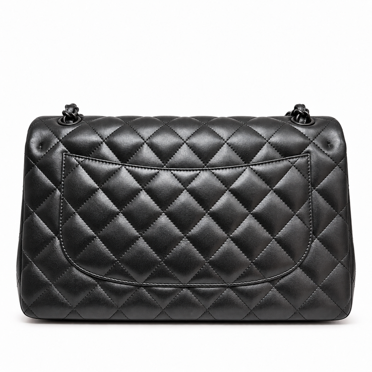 Black Chanel quilted jumbo double flap shoulder bag made of crumpled lambskin with a classic quilted design and silver hardware.