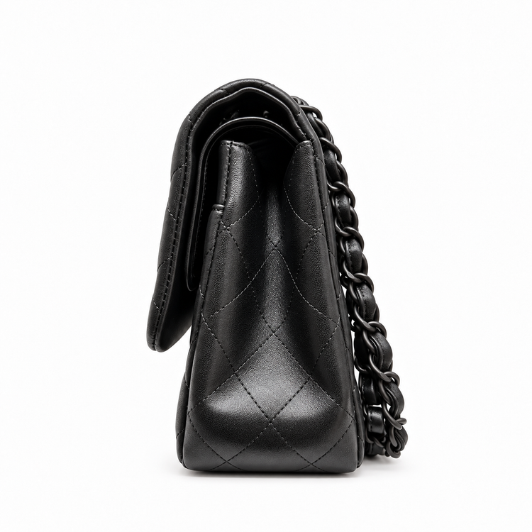 Black quilted jumbo double flap shoulder bag by Chanel featuring crumpled lambskin and signature chain strap.