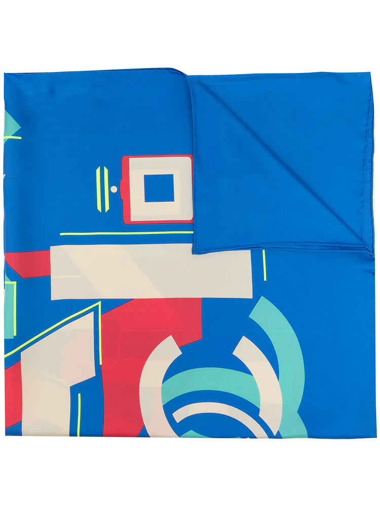 Blue Chanel silk scarf with geometric logo design, featuring elegant patterns on smooth, luxurious fabric.
