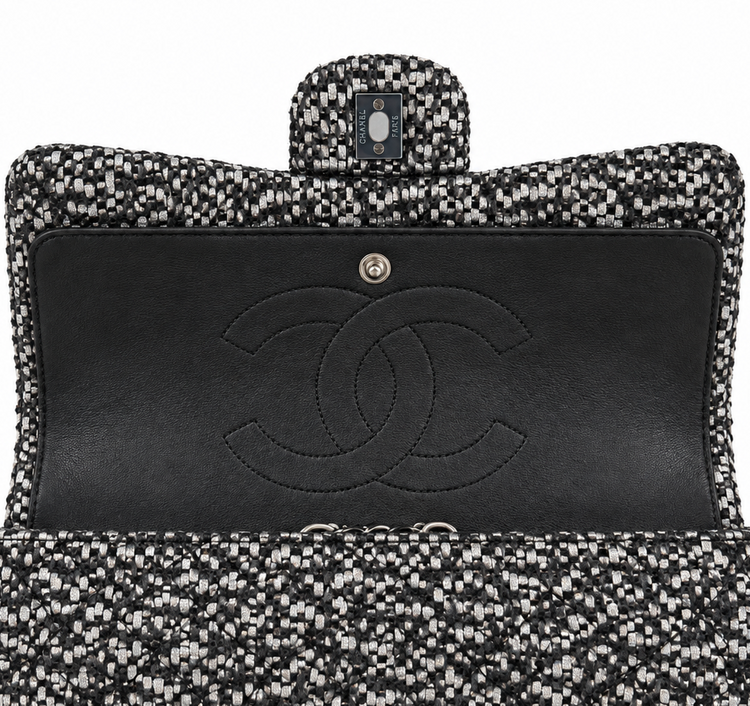 Silver tweed Chanel shoulder bag with sequins and a double flap design, featuring a chic, elegant style.