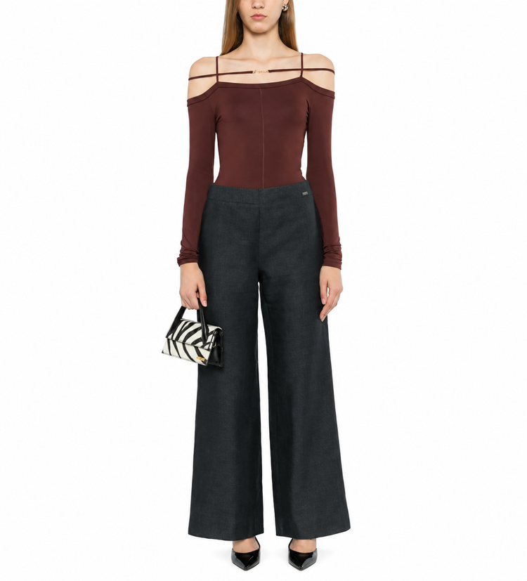Charcoal linen wide-leg trousers by Chanel, showing relaxed fit and elegant drape on a model.