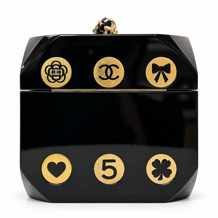 Chanel Plexiglass casino dice minaudière clutch with clear and black dice design, elegant evening accessory.