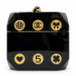 Chanel Plexiglass casino dice minaudière clutch with clear and black dice design, elegant evening accessory.