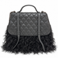 Chanel Paris-Dallas double flap quilted handbag with fur accents, featuring a classic quilted leather design and gold-tone hardware.