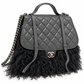 Chanel Paris-Dallas double flap quilted handbag with fur accents, featuring chain strap and classic quilted design.