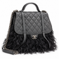 Chanel Paris-Dallas double flap quilted handbag with fur accents, featuring gold chain strap and classic quilted leather design.