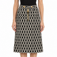 Gucci monochrome optical tweed skirt with tailored fit and textured fabric, shown on a model.
