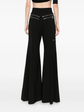 Chloé flared zip trousers featuring high waist, tailored fit, and stylish design, shown in a sleek, modern look.