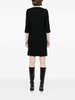 Pre-owned CHLOÉ tailored silk dress displayed on a hanger, showcasing elegant fabric and sophisticated design.